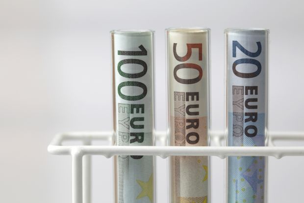 Euro banknotes in test tubes