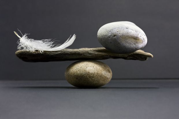 A feather and a stone equally balanced