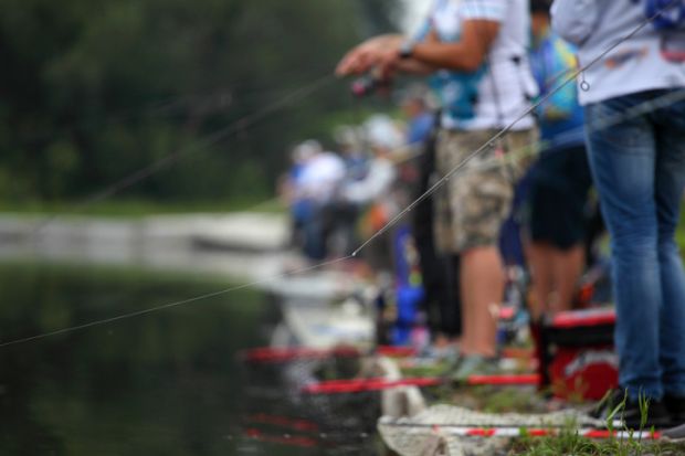 Many people fishing in the same river, representing a grants commons