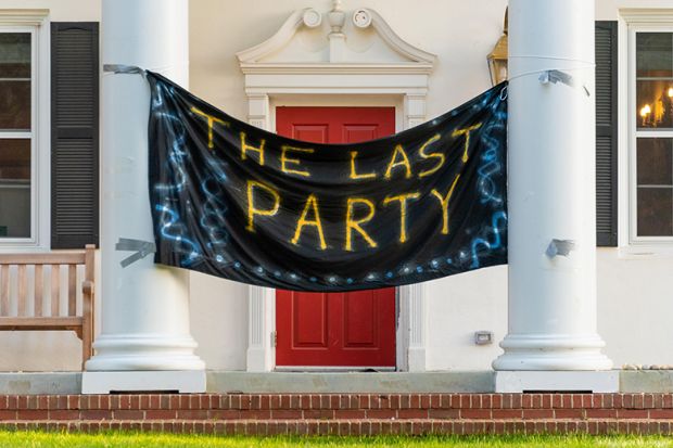 The Last Party banner hangs between the front columns of a fraternity house. To illustrate hazing at universities in the USA.