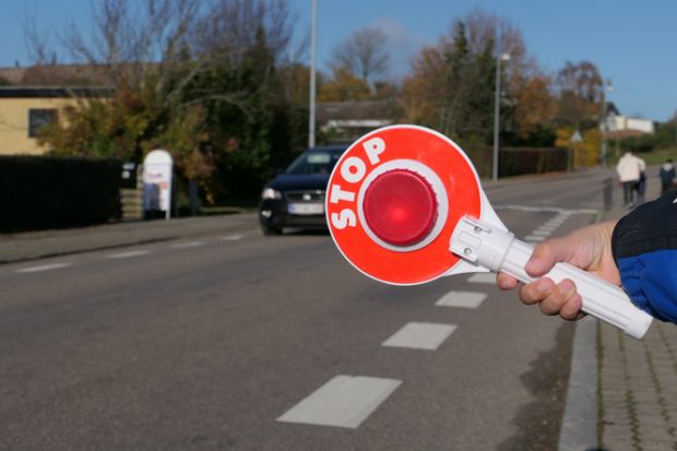 A stop sign at a pedestrian crossing in Denmark A stop sign at a pedestrian crossing in Denmark