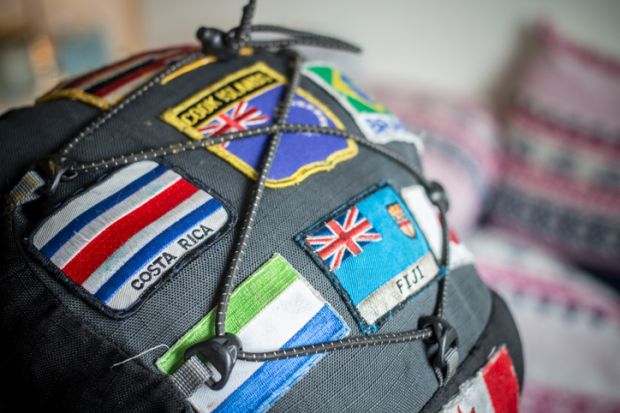 Close up of patches showing national flags sewn onto a backpack Close up of patches showing national flags sewn onto a backpack