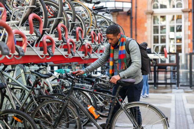 Student Parking His Bike In The City