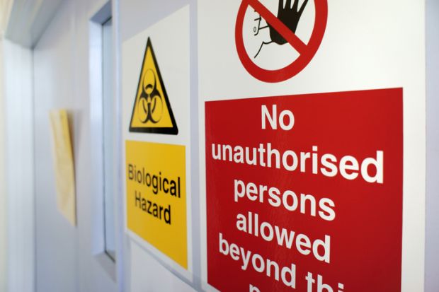 Biological hazard sign on a laboratory door Biological hazard sign on a laboratory door