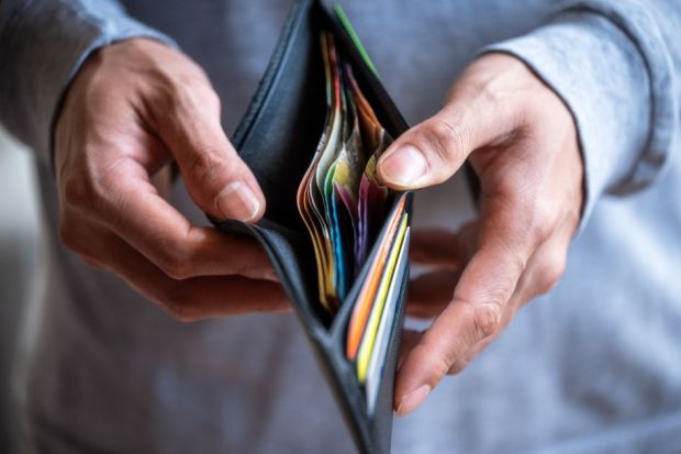 Man opening wallet Man opening wallet