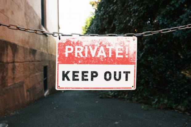 Keep out sign on a metal chain Keep out sign on a metal chain