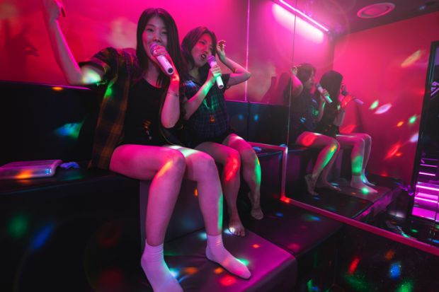 Korean friends enjoying karaoke night Korean friends enjoying karaoke night