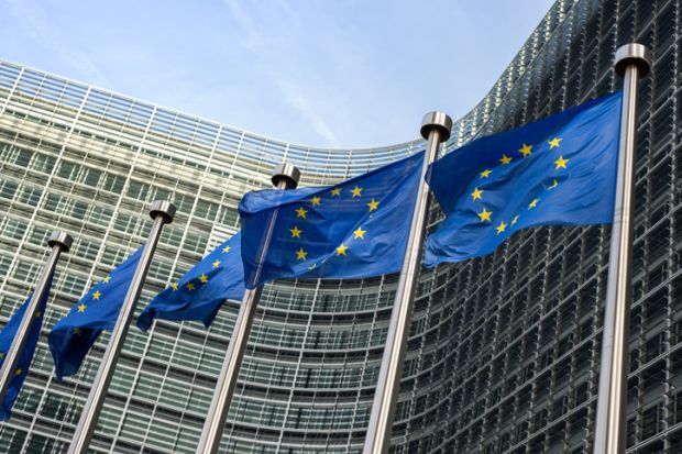 European flags waving in the wind side by side in front of the Berlaymont building