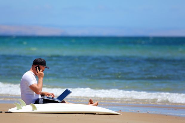 A man working when he should be surfing