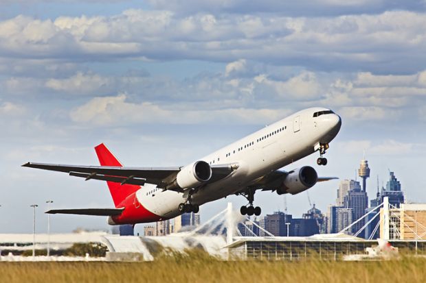 Passenger plane taking off from airport in Sydney