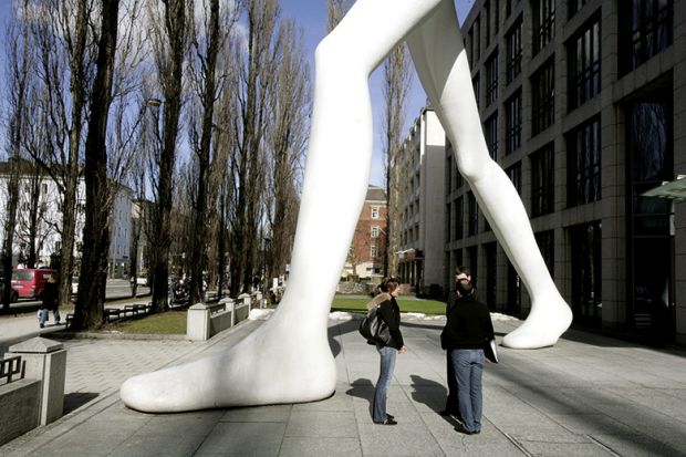 Giant statue stands over crowd