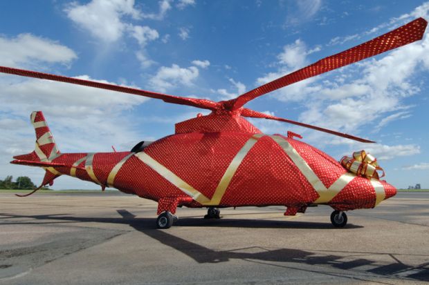 Gift-wrapped helicopter on launch pad