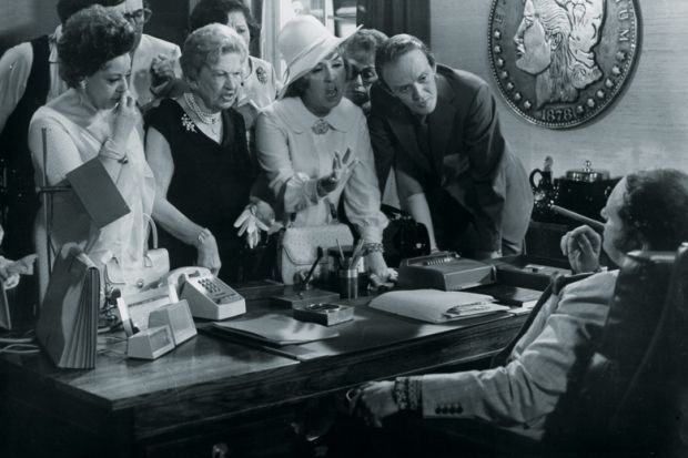 Group of people complaining at desk Group of people complaining at desk