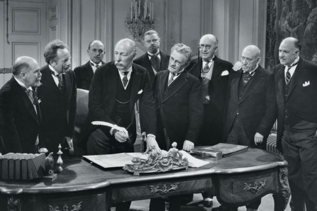 Group of old men signing paperwork