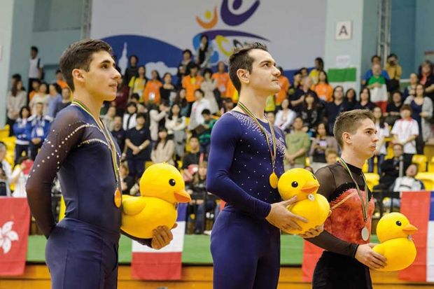 gymnasts-holding-ducks