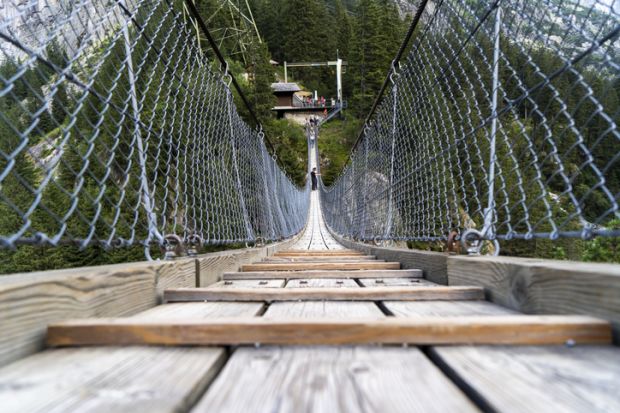 Handeggfallbrücke, a pedestrian bridge located in the heart of the Swiss Alps