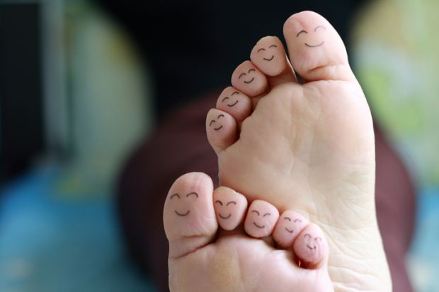 Smiley faces drawn on toes