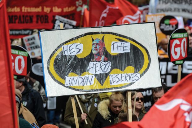 Health, Homes, Jobs and Education demonstrators hold Jeremy Corbyn placard, London