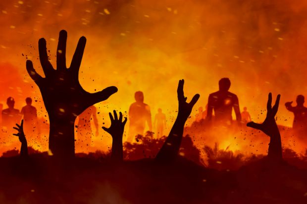 Raised hands in a flaming landscape