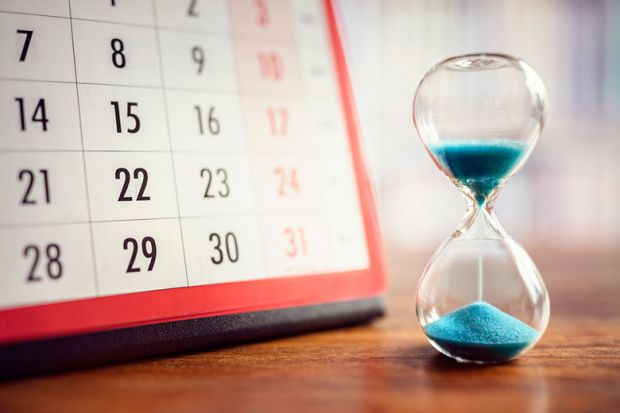 hourglass and calendar, illustrating delays in decisions over research funding grants