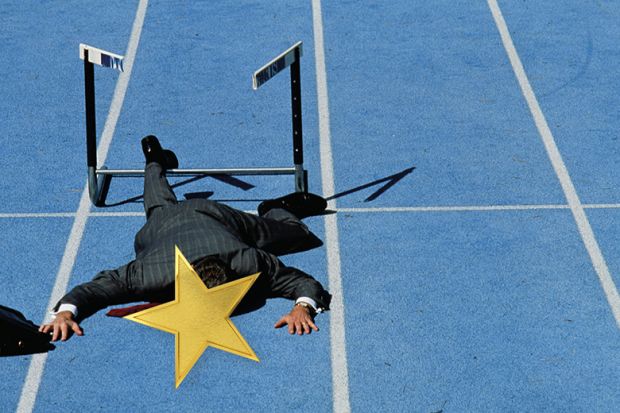 Hurdler flat on his face with gold star