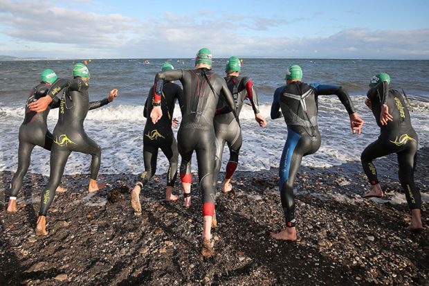 Athletes start the swim section of an ironman competition, Edinburgh, Scotland. To illustrate universities preparing for a ‘highly competitive’ clearing round. Athletes start the swim section of an ironman competition, Edinburgh, Scotland. To illustrate universities preparing for a ‘highly competitive’ clearing round.