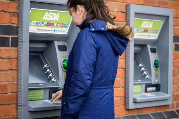 Young adult woman withdrew from cash machine. Young adult woman withdrew from cash machine.
