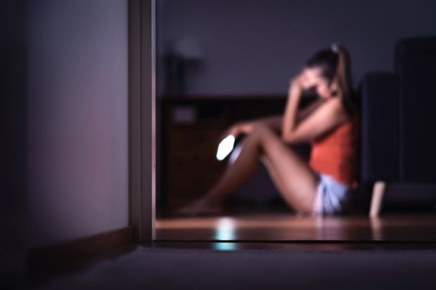 Online safeguarding should be higher up university agendas A student reacts with sadness to her mobile phone - online safeguarding should be higher up university agendas