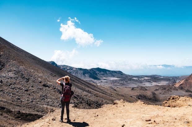 New Zealand, North Island, People enjoying the beautiful Landscape view of Tongariro Crossing track on a beautiful day with blue sky