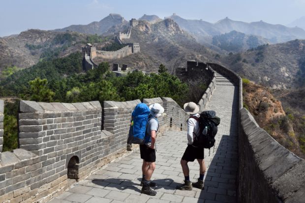 Backpacking walkers on the Great Wall of China