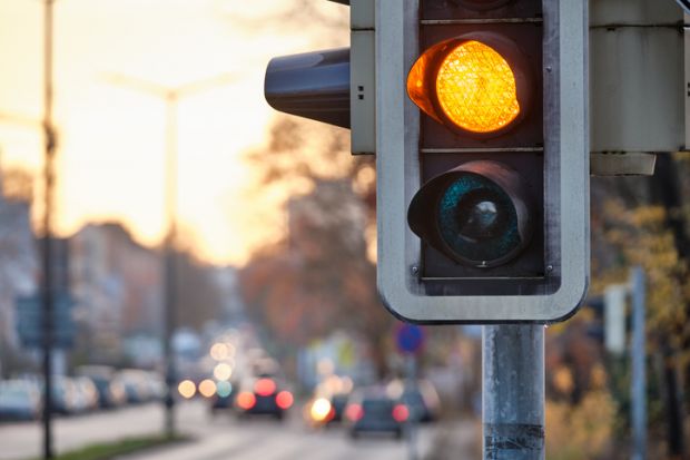 Closeup of traffic lights showing orange color