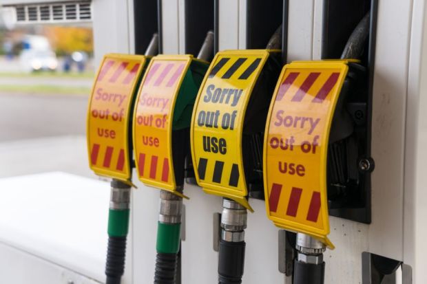 Out of use signs on petrol station pumps 