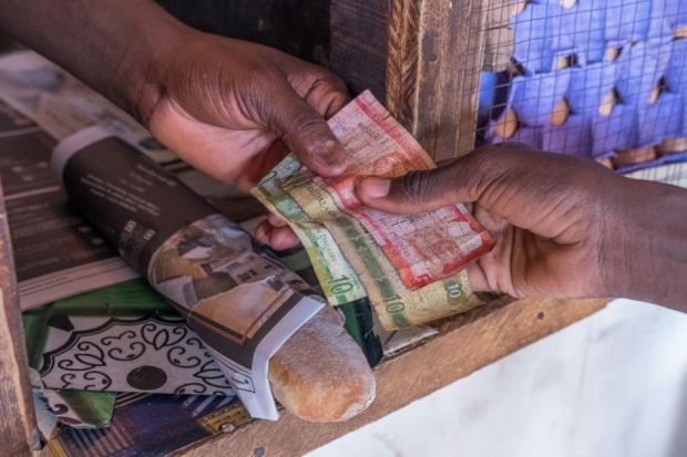 Scene with payment of money in a shop