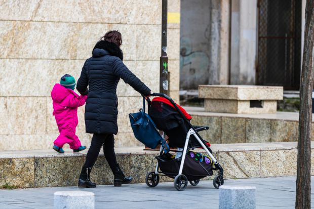 mother with child in front of a laptop computer mother with child in front of a laptop computer