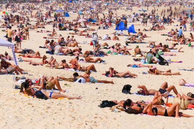 Crowd of people on Bondi Beach in the Eastern Suburbs of Sydney