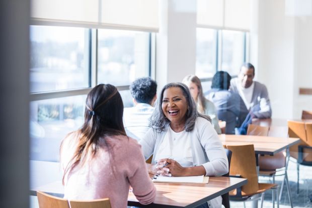Woman helping student