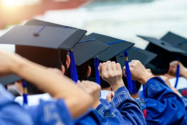 Graduates during commencement Graduates during commencement