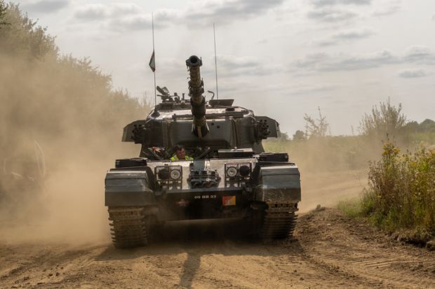 Close up of an army tank on a military training session.