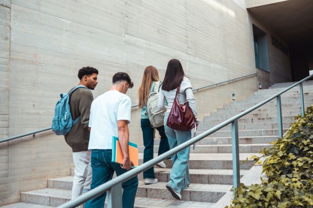 students climbing campus stairs students climbing campus stairs