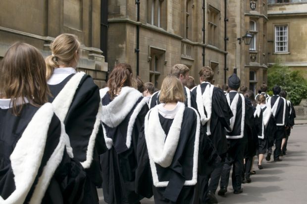Cambridge University students from Clare College dressed in their graduation gowns on graduation day