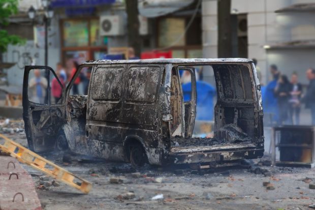 Burned car illustrating MA focusing on researching and reporting far-right extremism