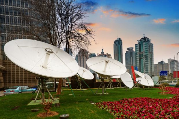 Shanghai's skyscrapers and satellite antenna.