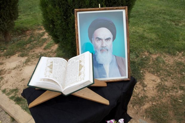 photograph of the Ayatollah Khomeini at the entrance gate of the Mausoleum of Saadi.