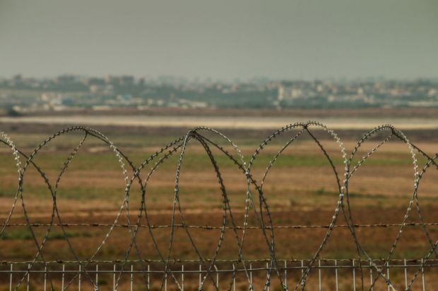 Barbed wire fence between Israel and the West Bank