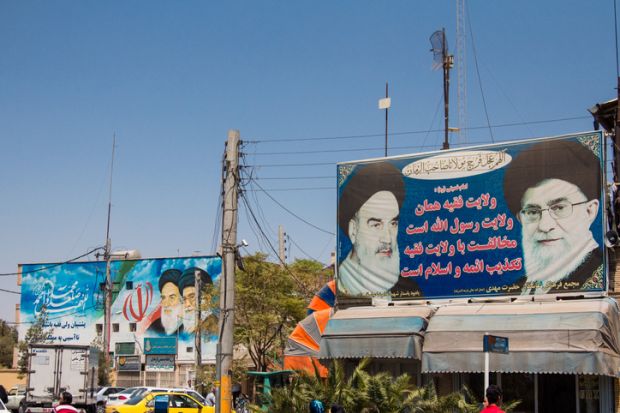 photograph of the Ayatollah Khomeini at the entrance gate of the Mausoleum of Saadi.