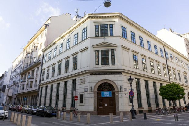 A three-story, beige building in Budapest 