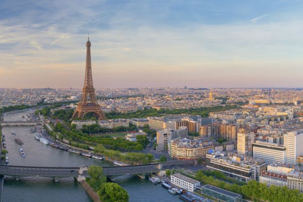 Aerial view of Paris with Eiffel tower during sunset