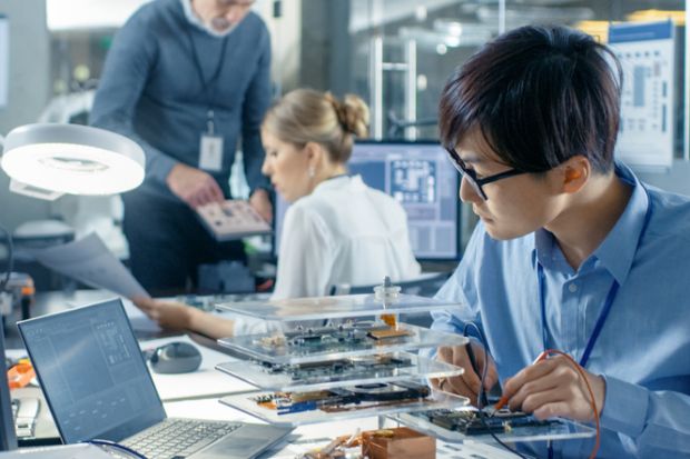 Computer scientist researching in their laboratory