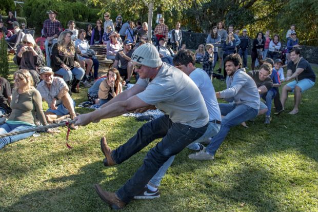 Tug of wars pitch teams against each other Tug of wars pitch teams against each other