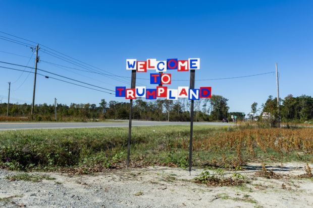A sign reading "Welcome to Trumpland"